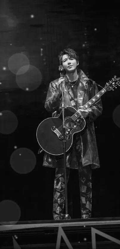 Black and white wallpaper of a musician with a guitar.