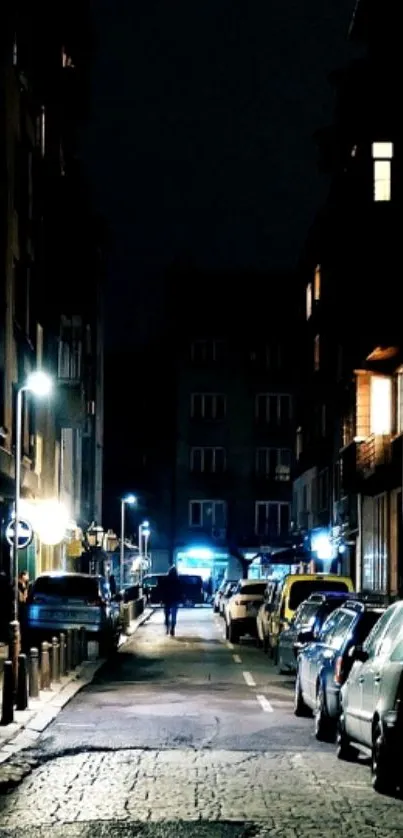 Dark urban street with glowing city lights at night.