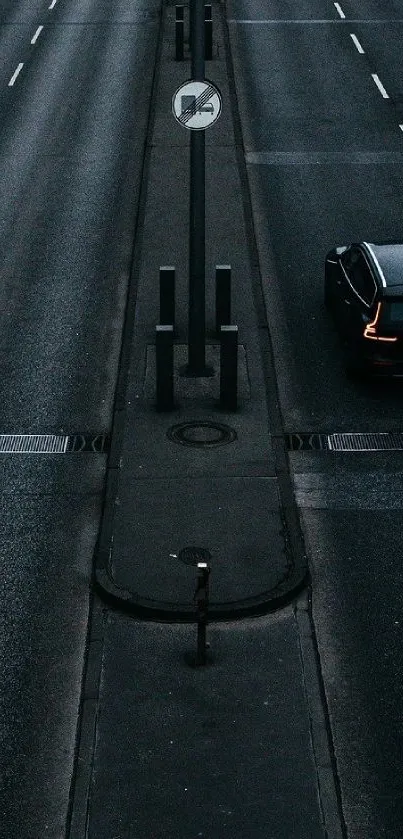 A moody night road scene with a solitary car and street lights.