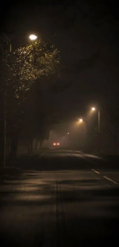 Moody night road with streetlights casting shadows.