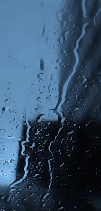 Moody mobile wallpaper with raindrops on a window in dark blue hues.