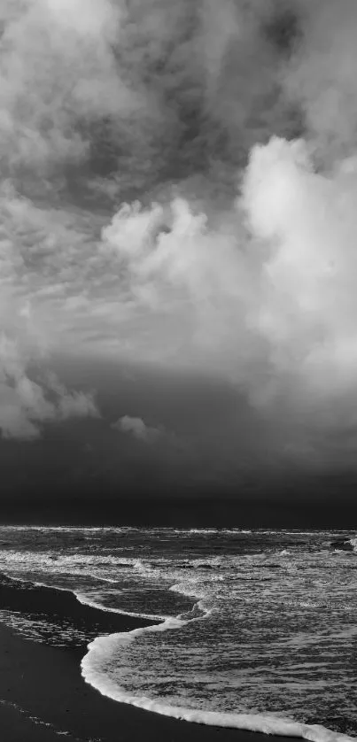 Black and white seascape with dramatic clouds and ocean waves.