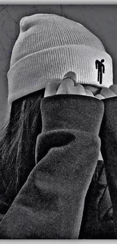 A monochrome stylish figure wearing a beanie, highlighting minimalist fashion.