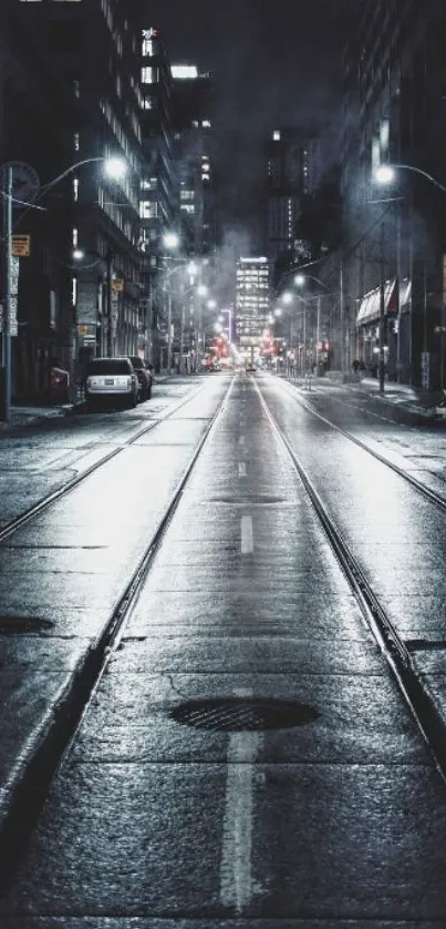 Moody urban street at night with city lights and misty atmosphere.