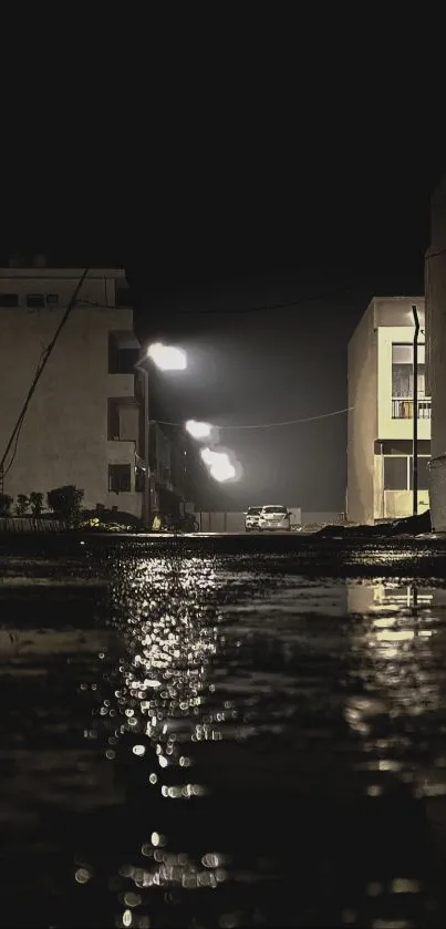 Moody urban street at night with dim lights and reflections.