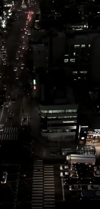 A dark city street with vibrant lights and traffic view at night.