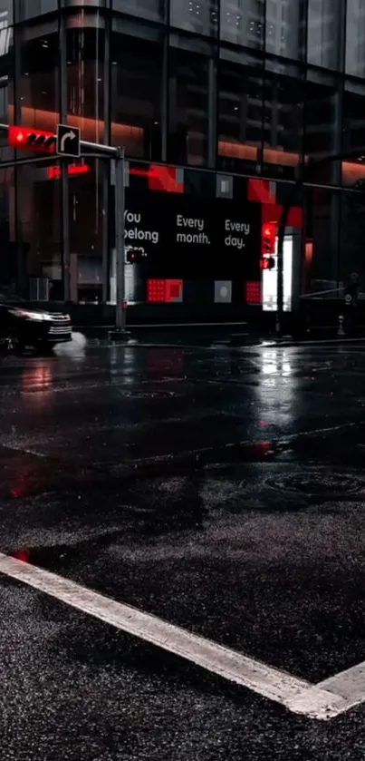 Moody urban street at night with wet road and city lights.