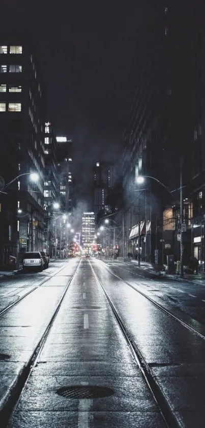 Moody urban street at night with city lights.