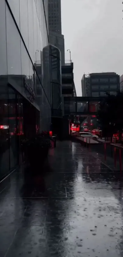 Moody urban street with rain reflections and red lights at night.