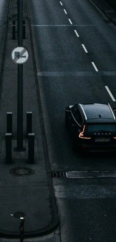 Moody urban street with a sleek car.