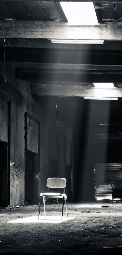 A solitary chair in a dimly lit, abandoned warehouse with beams of light.