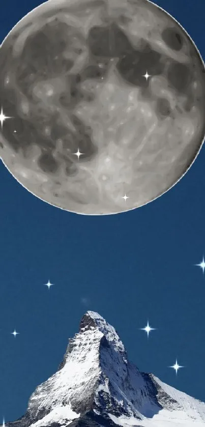 Moon above snowy mountain peak at night.