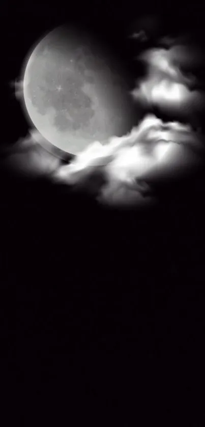 Moon shining through clouds in night sky wallpaper.