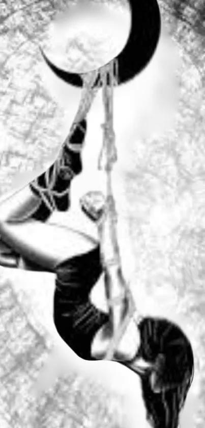 Black and white acrobat under crescent moon wallpaper.