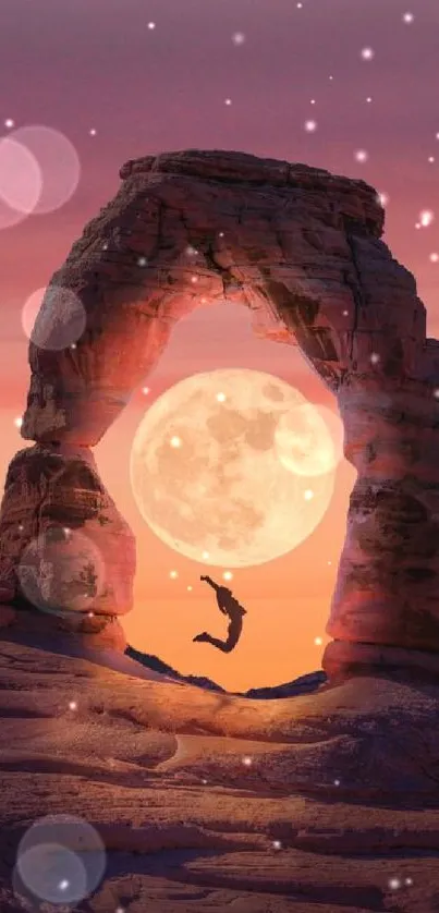 Person jumps under a rock arch with a full moon in the background.