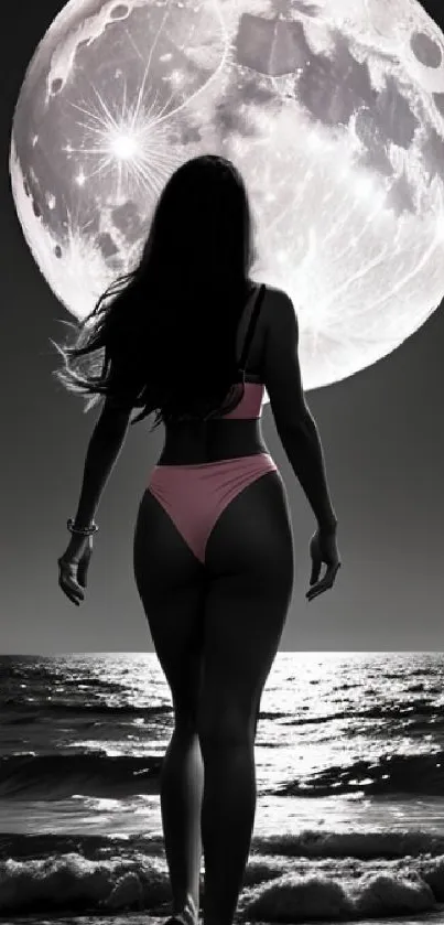 Woman silhouetted against moon on beach at night.