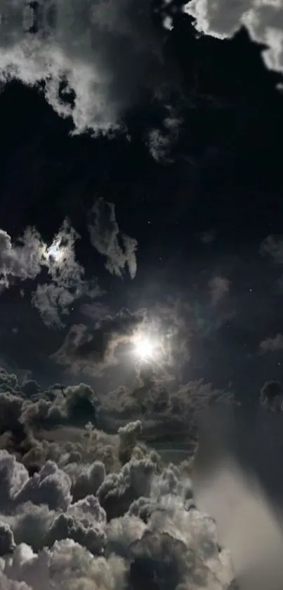 Moonlit night sky with cloudy atmosphere.