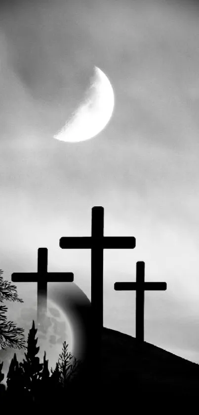 Moonlit crosses on a hill with orange sunset background.