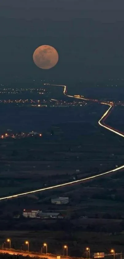 Moonlit highway stretching into the night under a clear sky.