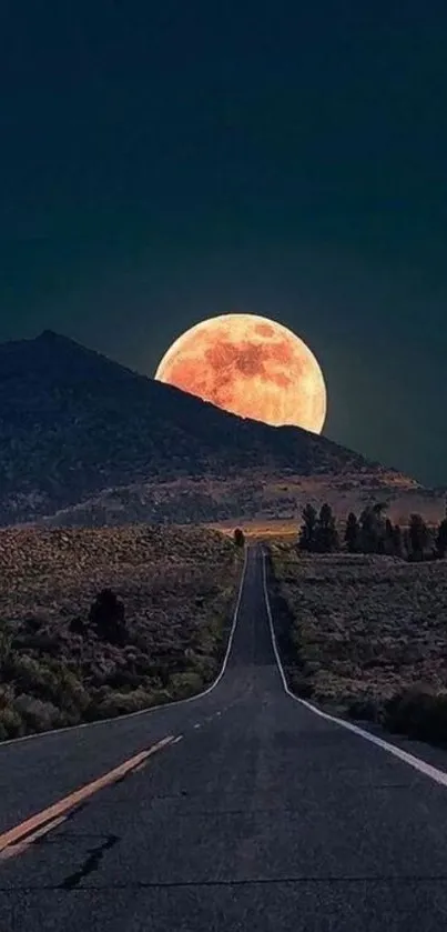 Moonlit road leading to mountain in dark night sky.