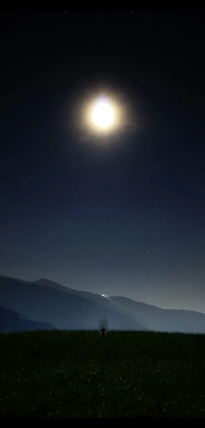 Moonlit night sky with mountain silhouette and peaceful horizon.