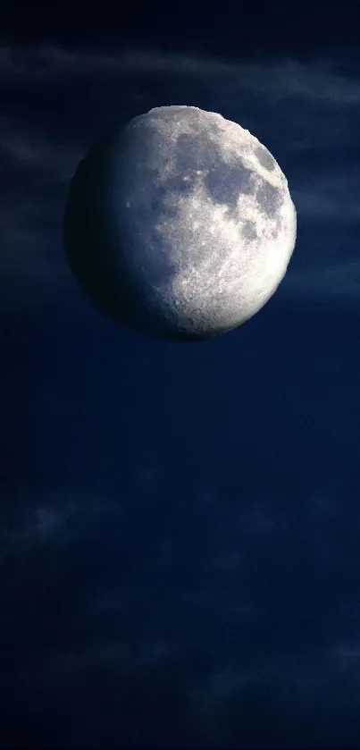 Moonlit night sky wallpaper with glowing moon and dark blue backdrop.