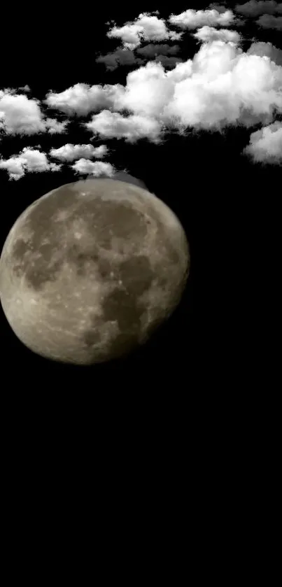 Moonlit night sky with clouds and a bright moon.