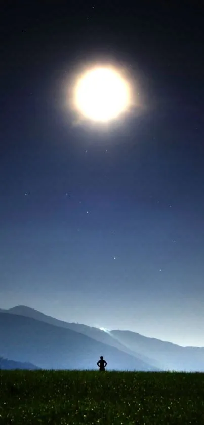 Silhouette under a luminous full moon in a serene night landscape.