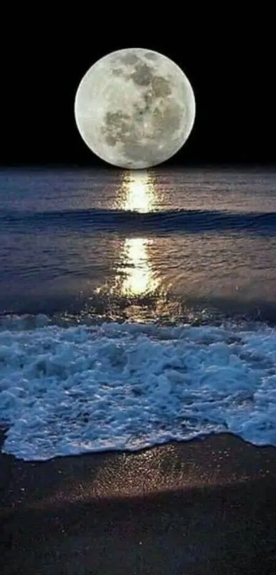 Full moon over tranquil ocean with gently crashing waves at night.