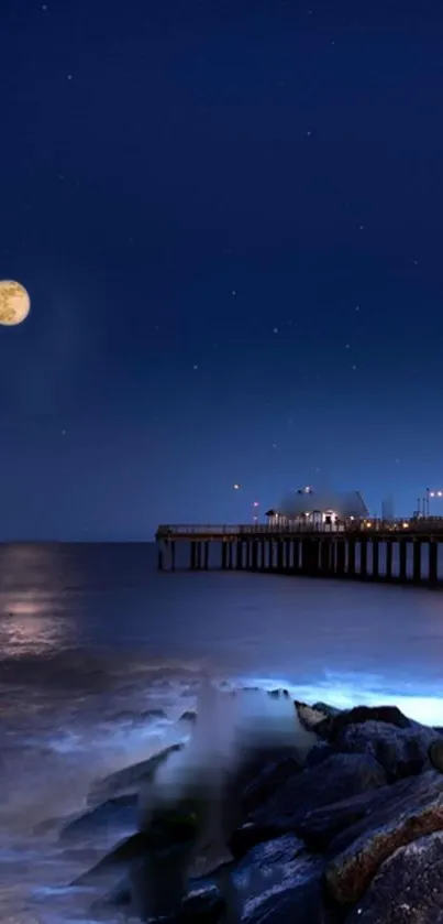 Moonlit ocean pier under a starry night sky.