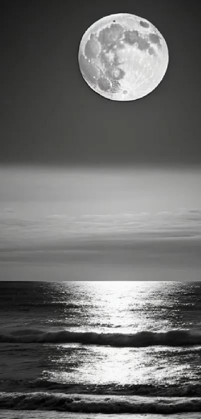 Moonlit ocean with reflections in a black and white serene setting.