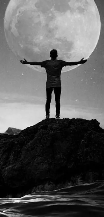 Silhouette of a man with a large moon backdrop, creating a serene wallpaper.