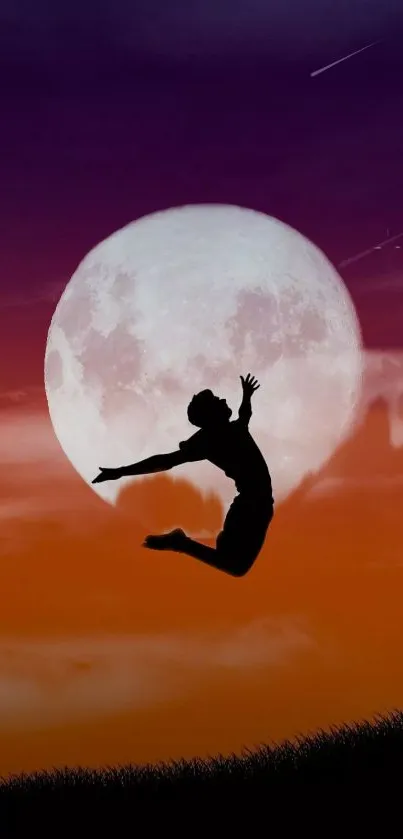 Silhouette jumping in front of full moon with colorful sunset sky.