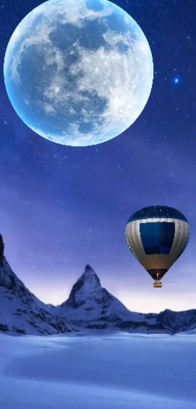 Hot air balloon under full moon over snowy mountains at night.