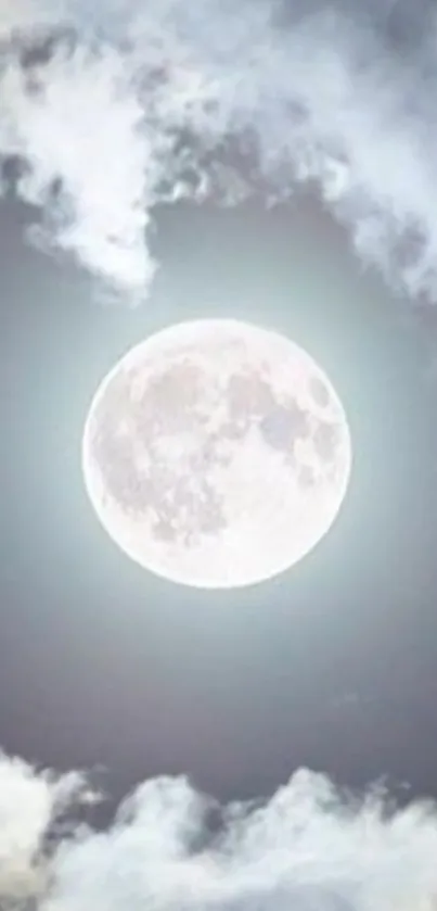 Full moon surrounded by clouds illuminating the night sky.