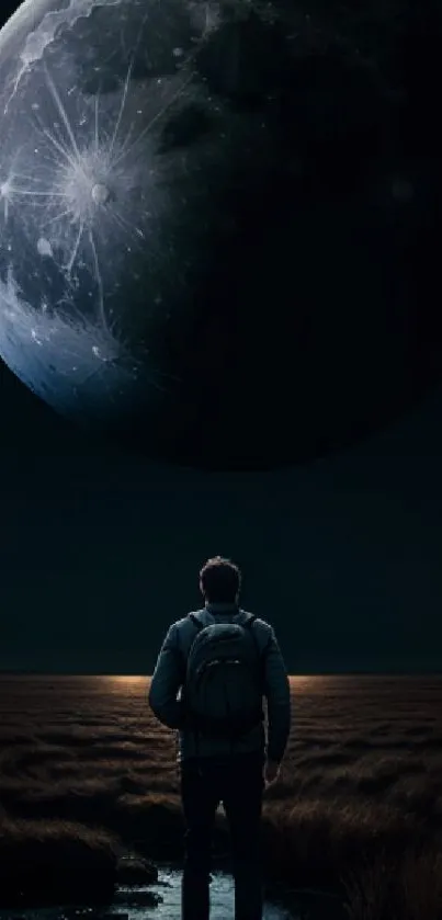 A person gazing up at a massive moon in a dark, open landscape.