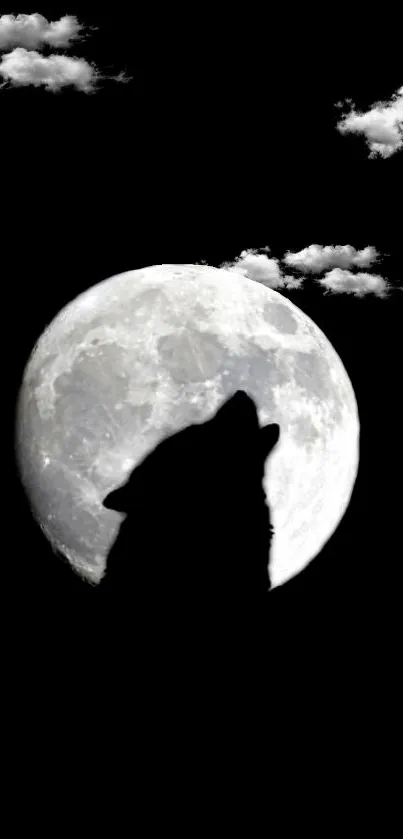 Wolf silhouette against a full moon with clouds.