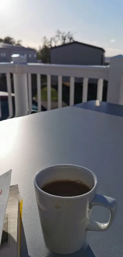 A tranquil scene of a coffee cup and book on a sunlit balcony table.