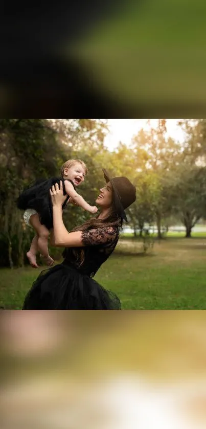 Mother holding child in sunny park with green trees.