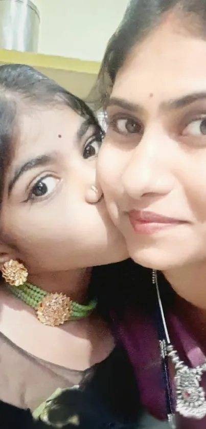 Close-up of a mother and child smiling.