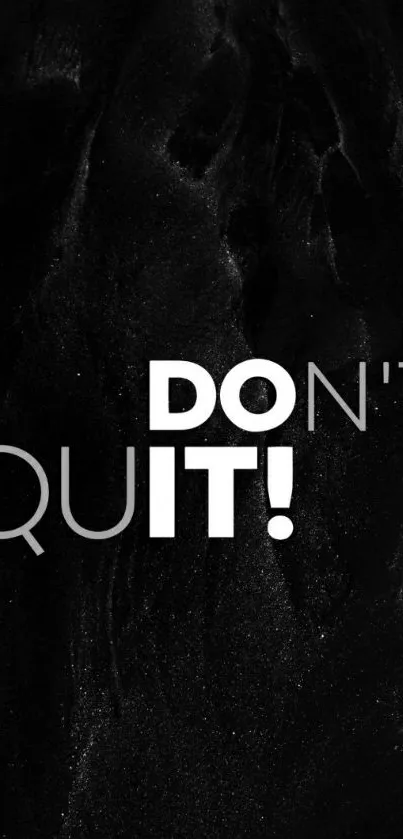 Black wallpaper with the words 'DON'T QUIT!'