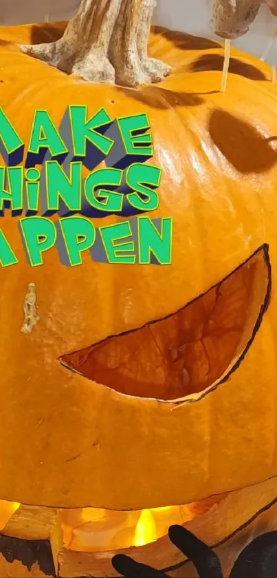 Orange pumpkin with inspiring quote 'Make Things Happen' carved into a jack-o'-lantern.