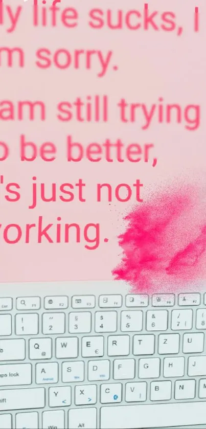 Inspirational quote on a pink background with a keyboard element.