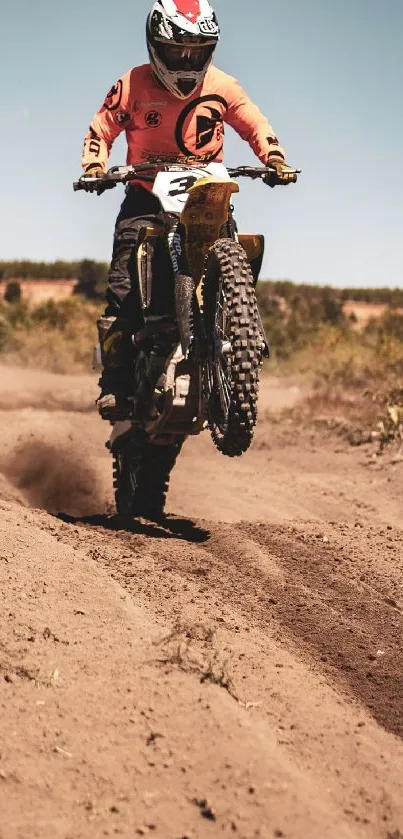 Motocross bike jumps on a dirt track in action-filled scene.