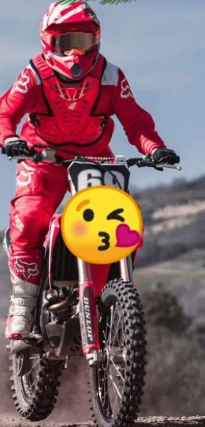 Motocross rider in vibrant red gear on a dirt bike.