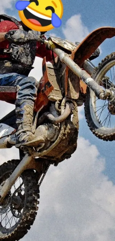 Motocross rider jumping with blue sky background.