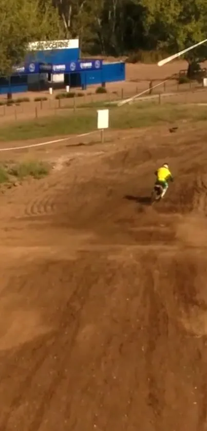 Motocross rider on a dirt race track.