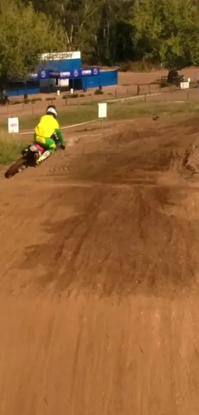 Motocross rider turns sharply on a dirt track, capturing speed and adventure.