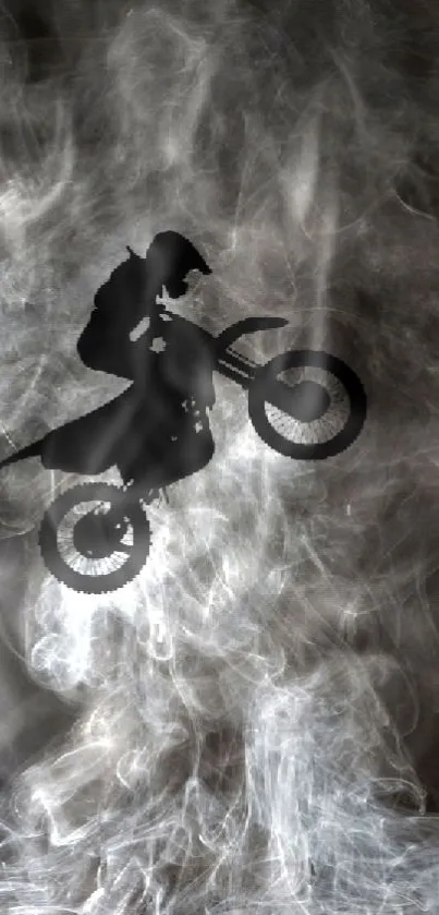 Motocross rider silhouette in smoke background wallpaper.