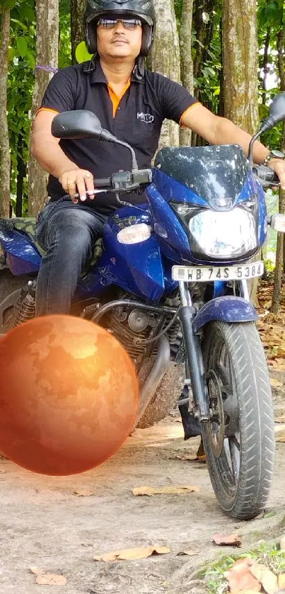 Man on motorbike in autumn forest with a surreal floating orb.